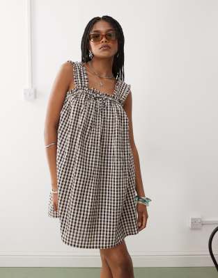 COLLUSION smock swing dress in beige and black gingham
