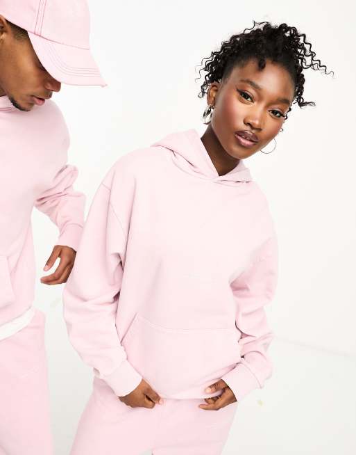 COLLUSION – STUDIOS – Rosa huvtröja i unisex-modell