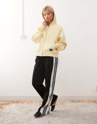 COLLUSION - Sweat à capuche oversize à fermeture éclair et clous - Babeurre-Jaune