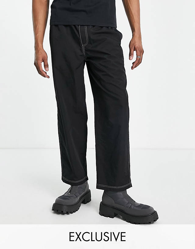 Collusion - tapered skate trousers in black with contrast stitch