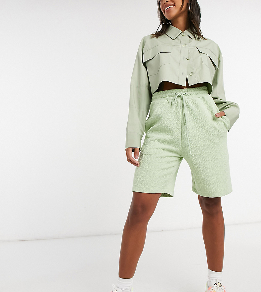 COLLUSION textured longline shorts in pale green