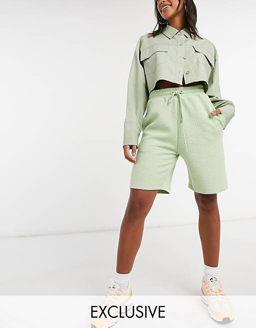 COLLUSION textured longline shorts in pale green