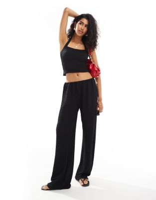 textured pants in black - part of a set