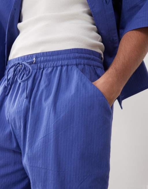 COLLUSION textured woven shorts in blue stripes