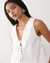 ASOS DESIGN sleeveless smock top with eyelet collar and tie neck in stone