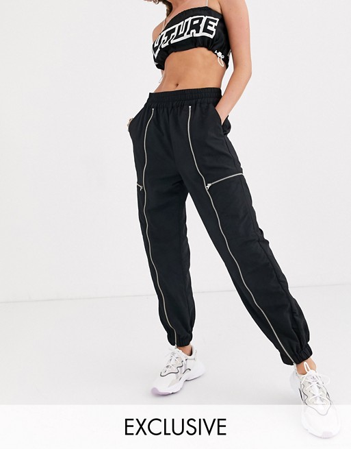 COLLUSION trouser with zip front detail in black