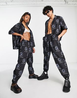 COLLUSION Unisex co-ord noughties fit joggers with all over print in black - ASOS Price Checker