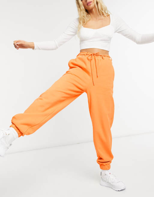 Orange and best sale white joggers