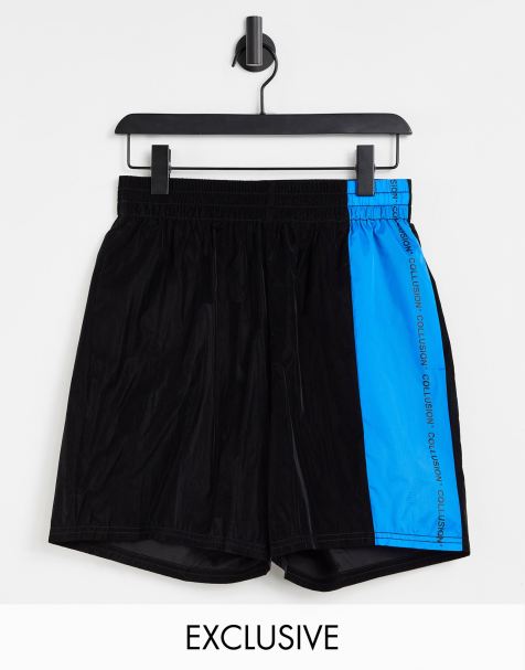 COLLUSION Unisex sport shorts in black with blue panel