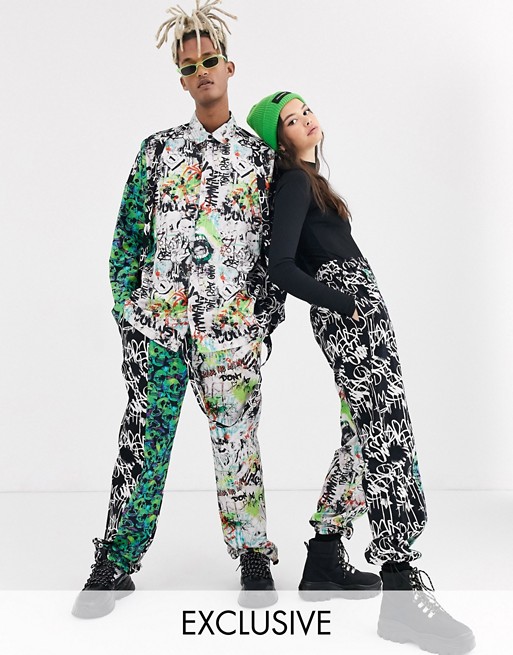 COLLUSION Unisex graffiti print trouser with strapping