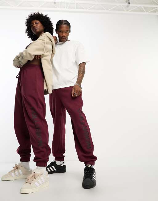 COLLUSION Unisex joggers in burgundy ASOS