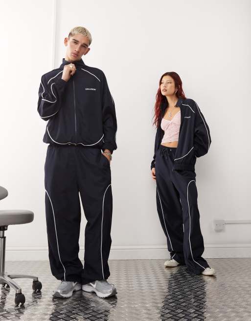 COLLUSION Unisex nylon jacket with contrast seam and print co-ord in navy, 2 of 4