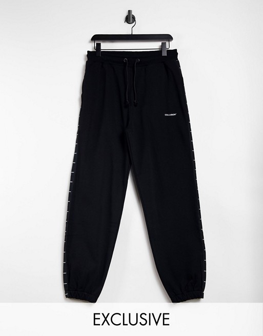 COLLUSION Unisex oversized joggers with logo side tape in black co-ord