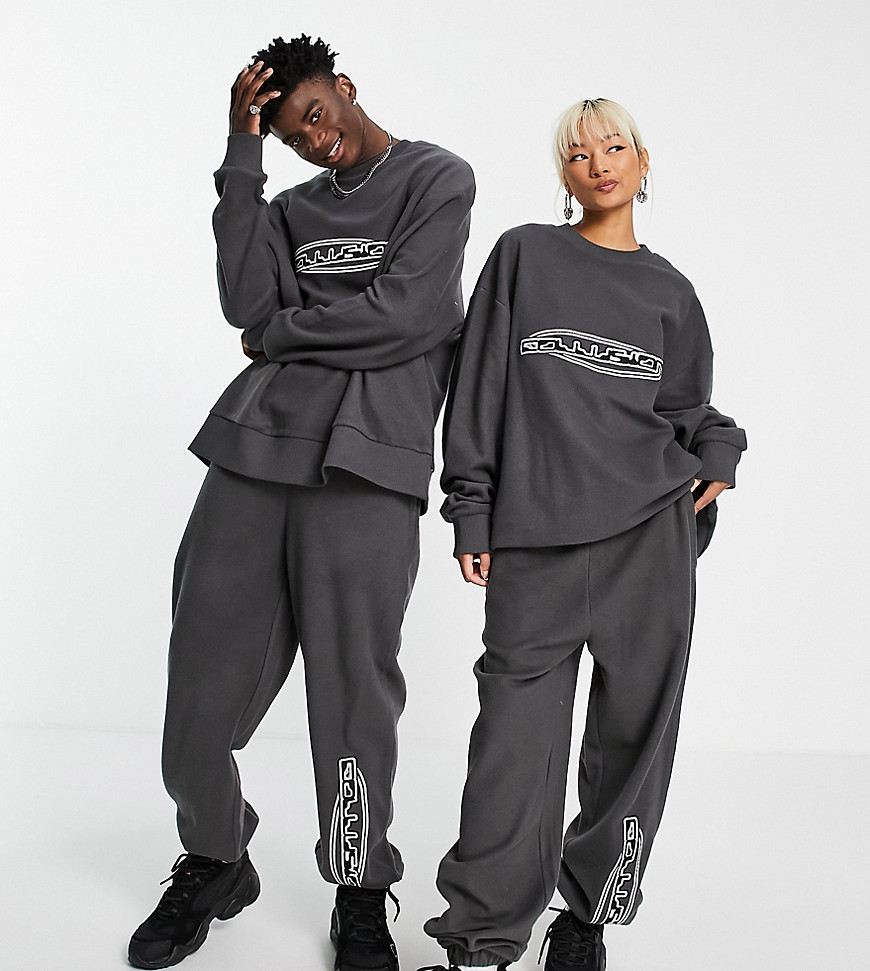 Joggers by COLLUSION Exclusive to ASOS Part of our responsible edit Sweatshirt sold separately Elasticated waist Side pockets Logo applique Oversized, tapered fit Unisex style