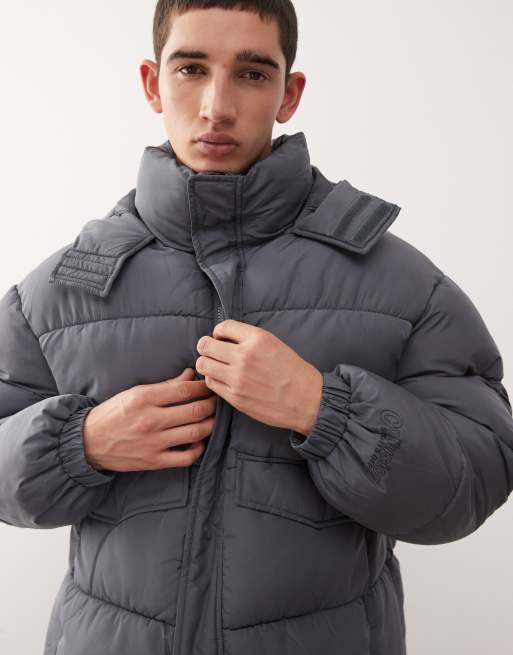 COLLUSION Unisex – Pufferjacke in Grau mit Kapuze