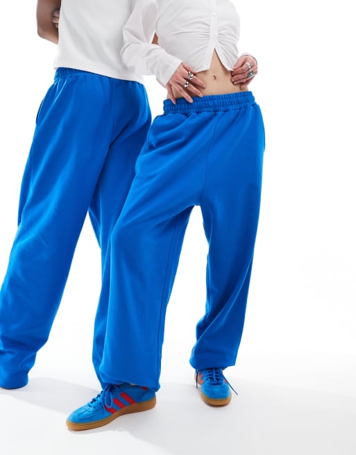 COLLUSION Unisex - Ruimvallende joggingbroek in middenblauw