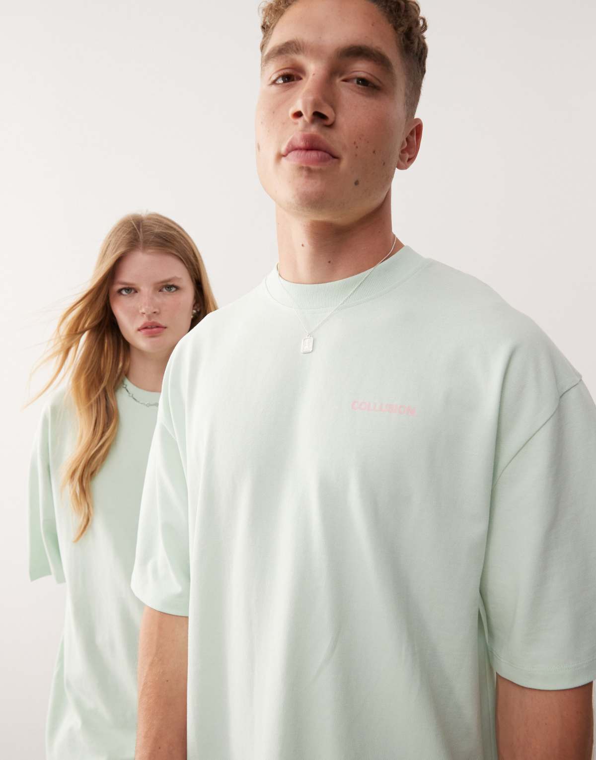 COLLUSION Unisex t-shirt in green with pink back print
