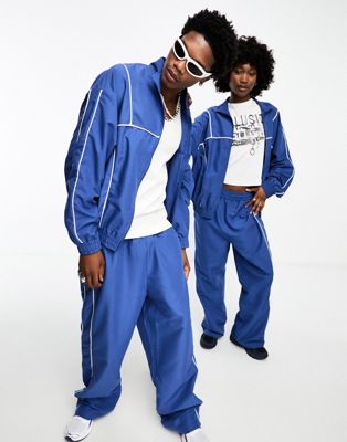 COLLUSION Unisex track jogger in blue co-ord