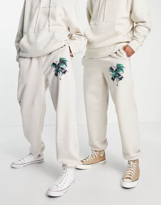 COLLUSION Unisex trackies with dragon logo back print in stone (part of a set)