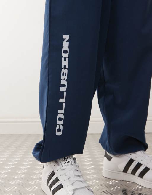 COLLUSION Unisex - Trainingspak met nylon inzetstukken in blauw, deel van co-ord set, 3 van 5