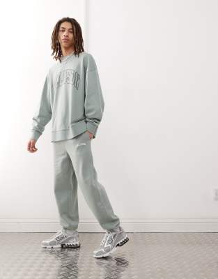 varsity sweatpants in green with print - part of a set