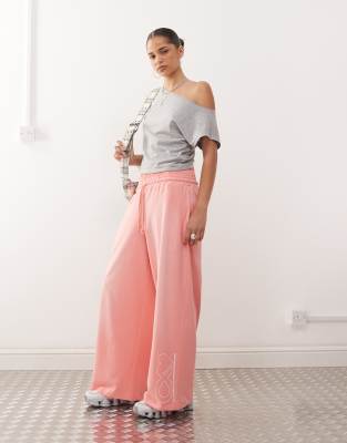 COLLUSION - Verwaschene Relaxed Fit Jogginghose mit „CX"-Print-Rosa