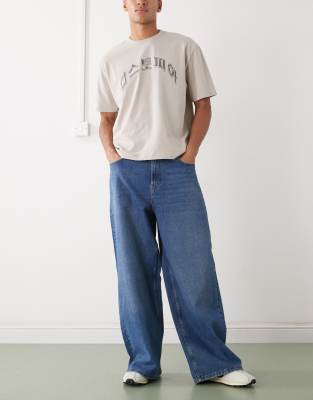 COLLUSION wide leg jeans in mid blue