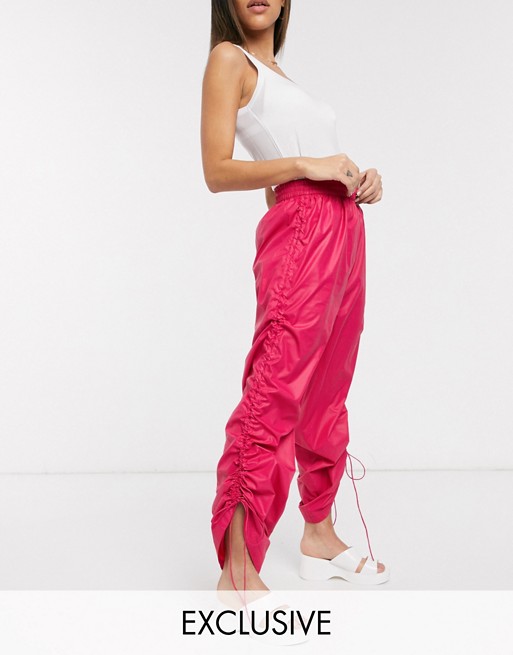 COLLUSION wide leg wet look trousers in pink