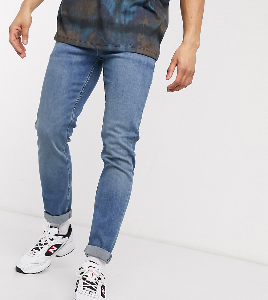 COLLUSION x001 – Enge Jeans in halbverwaschenem Blau