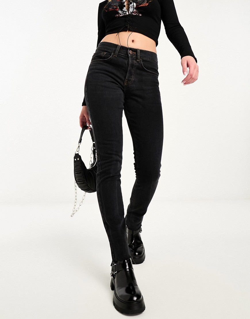 COLLUSION x001 mid rise drainpipe skinny jeans in washed black with raw hem
