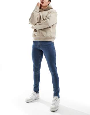 COLLUSION x001 mid rise skinny jean in blue - ASOS Price Checker
