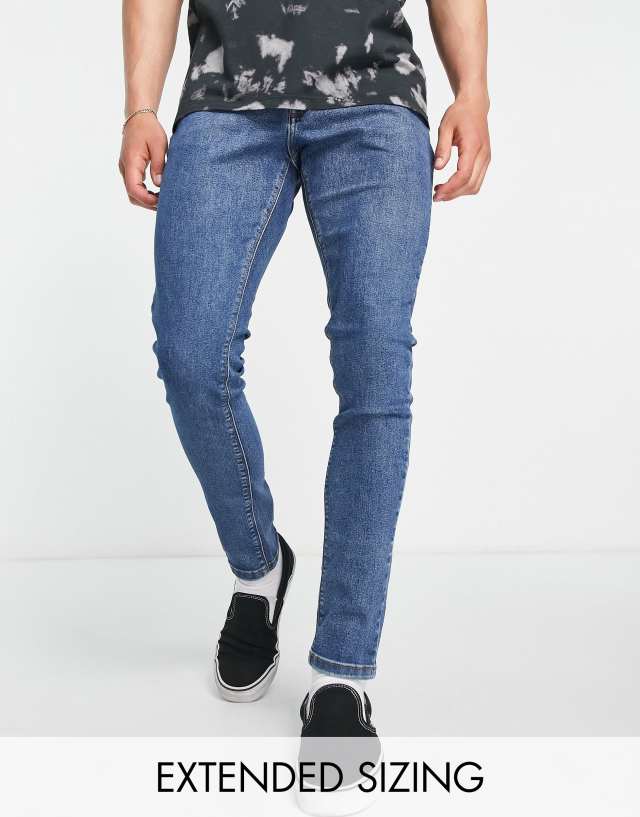 COLLUSION x001 skinny jeans in blue mid wash