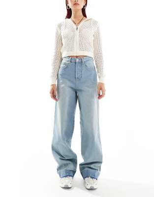 X002 baggy jeans with let down hems in midwash blue