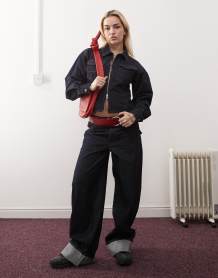 Weekday boat neck long sleeve top with eyelet split hem detail in black