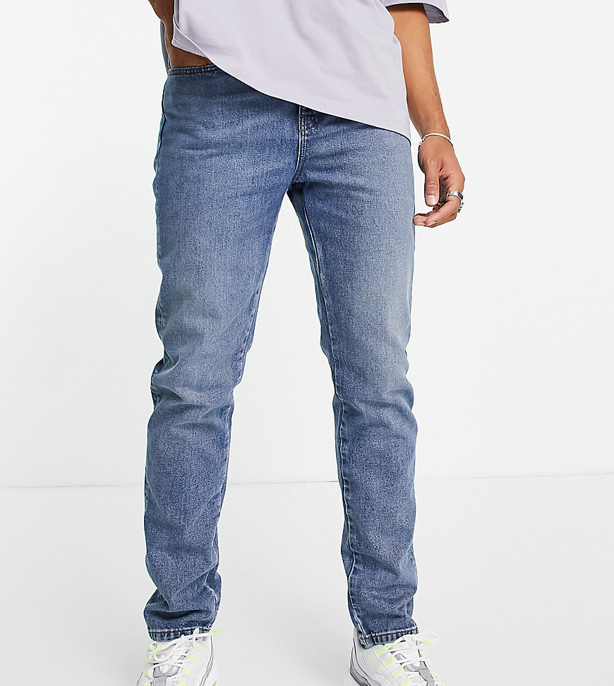 COLLUSION - x003 - Toelopende jeans van biologisch katoen in middenblauwe wassing