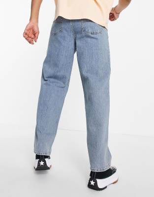 COLLUSION – x014 – Weite Jeans im Stil der 90er in Stonewash-Blau mit  Rissen | ASOS
