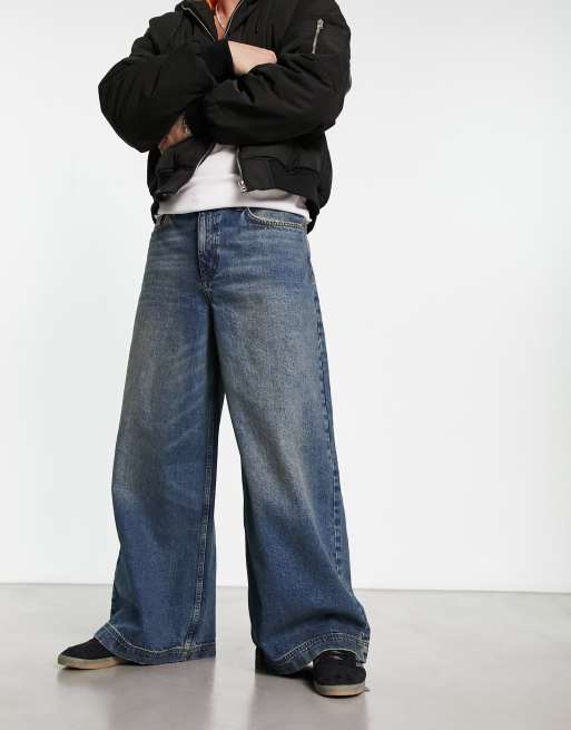 COLLUSION x019 - Ruimvallende jeans met wijde pijpen in Y2K dirty wash blauw
