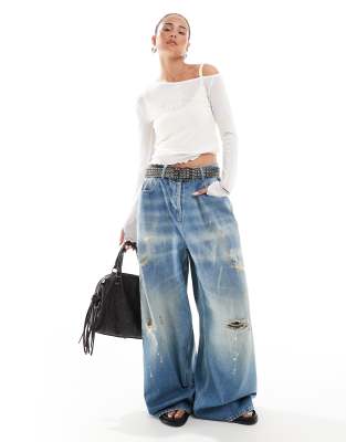 COLLUSION - XL - Weite Jeans in Used-Waschung mit niedrigem, verstellbarem Bund-Blau