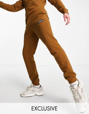 COLUMBIA CLIFF GLIDE SWEATPANTS IN BROWN EXCLUSIVE AT ASOS 