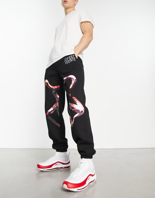 Coney Island Picnic seekers jersey sweatpants in black with graphic print