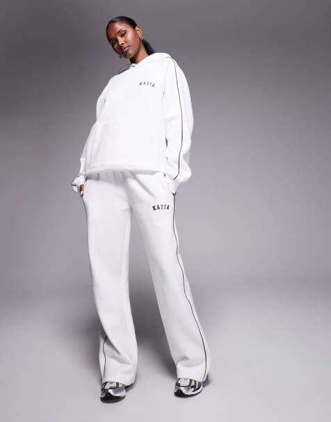Conjunto blanco de joggers de pernera ancha y sudadera con capucha, raya lateral y logo bordado de Kaiia - view 1