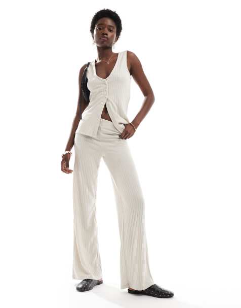 Conjunto color crema de pantalones de pernera ancha y top de corte alargado sin mangas de canalé de Vero Moda - view 1