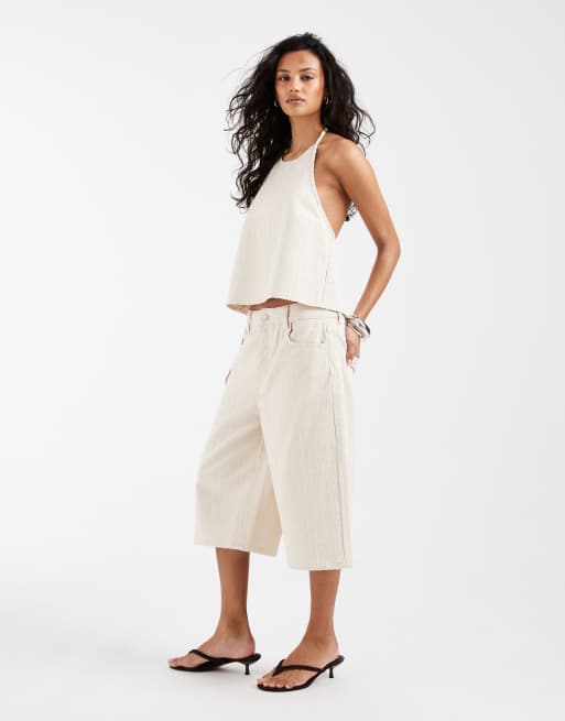 Conjunto color crudo de pantalones cortos vaqueros holgados texturizados estilo bermudas y top vaquero de tirantes con lazada en la espalda de ASOS DESIGN