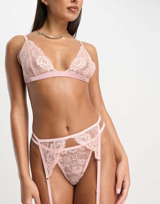 Conjunto de lencería rosa de sujetador, braguitas y liguero con