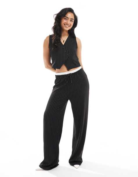 Conjunto de sastre negro con raya diplomática de pantalones de pernera ancha y chaleco con tapeta asimétrica de Pieces - view 1