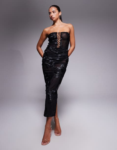 Conjunto negro con aplicaciones florales texturizadas de falda larga y top con escote palabra de honor y cordones de malla exclusivo de Murci - view 1