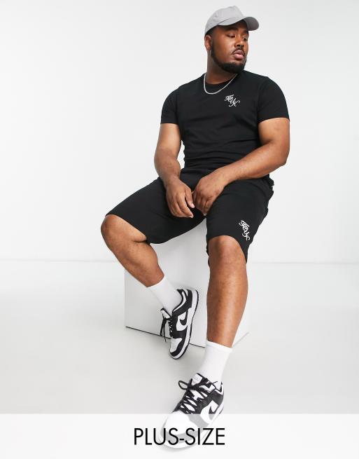 Conjunto negro de pantalones cortos y camiseta con logo de texto de FCUK Plus