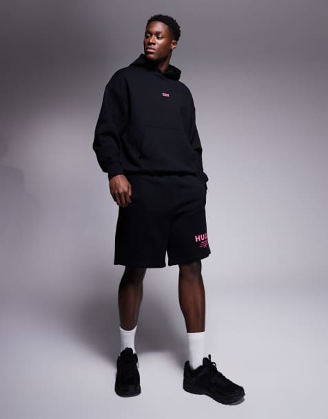 Conjunto negro de pantalones cortos y sudadera de corte suelto con capucha y logo rosa de Hugo Blue - view 1