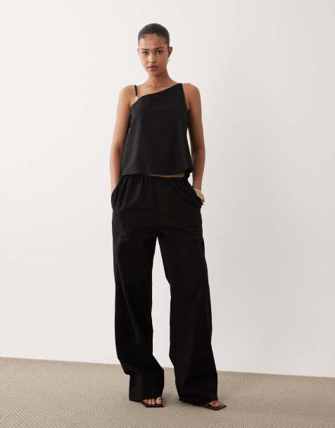 Conjunto negro de pantalones de pernera ancha y top asimétrico con detalle de cuenta de mezcla de lino de SNDYS - view 1