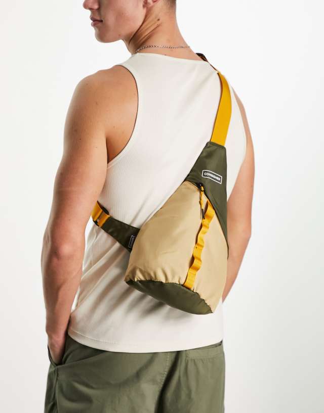 Consigned color block sling backpack in sand and khaki